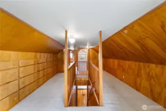 Beautiful wood in this upstairs hallway, just look at this storage.