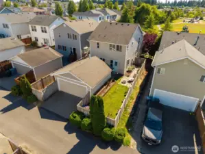 Rear Aerial View of house, detached 2-car garage and house.