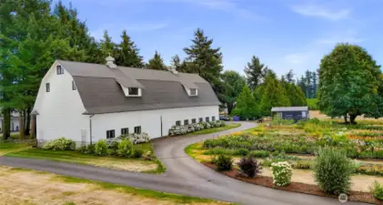 Beautifully maintained (new roof) historic dairy barn featuring an indoor silo and a potential event space with its nearly 4000 square feet of quality alongside your veggie and flower garden