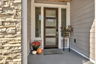 Front Covered Entry with frosted glass panel door.