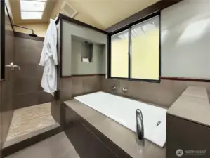 Master spa bathroom with dual shower heads, large tub
