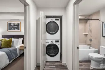 Unique main floor guest bedroom, full bathroom and laundry are uniquely positioned above ground level for ideal privacy & security.