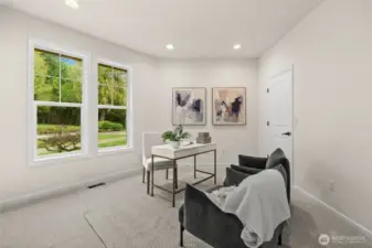 This bright, quiet home office floods in natural lighting with it's large open windows, perfect for remote work.