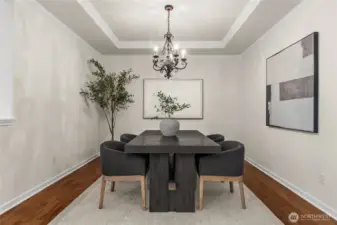 This elegant formal dining room is perfect for social gatherings and hosting.