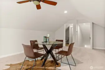 Head upstairs to enjoy this spacious bonus room immersed in natural lighting.