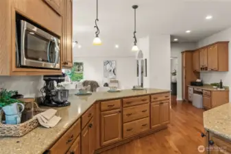 Enjoy this chef's kitchen with these beautiful granite countertops and massive kitchen island.