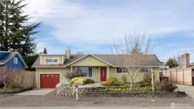 Charming North Tacoma rambler with vibrant curb appeal.