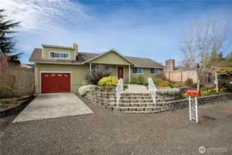Blooming gardens and inviting front entry welcome you to this comfortable single level living.