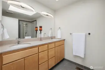 Spacious  bath with extended vanity, ample storage, and clean, timeless finishes.