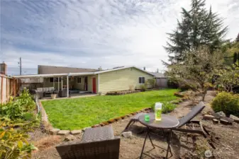 Outdoor setting patio space and open green areas, creating a peaceful retreat for gatherings, play, or quiet relaxation.