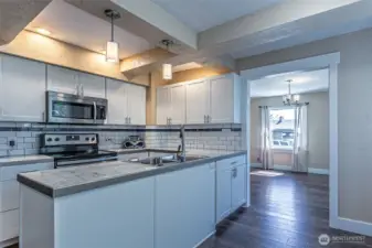 Updated kitchen with stainless appliances.