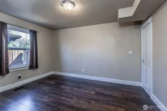 View of main level bedroom and side yard.