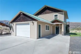 Front of the house, see side parking with RV hook up. Home is located on a quiet end of the street that heads to North Beach. Very popular all sand beach!