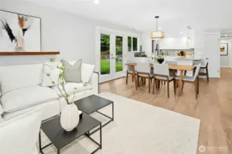 Space for a large dining table with gorgeous light fixtures throughout the home.