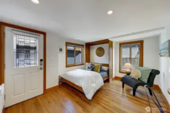 This is not the front door, but rather a side door dockside because the previous owner used to have this room set up for guests to come and go when they needed a place to rest.  There is also a door to enter the main bathroom from this room which creates a jack and jill bathroom.