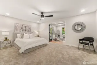 Primary suite has a BONUS room that could be a yoga room, office, reading nook... the possibilities are endless.  BRAND new carpet, paint, trim and light fixtures! Bonus room leads right to the deck.