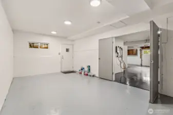 BONUS room in garage!  This photo also shows the tesla charging station that STAYS!