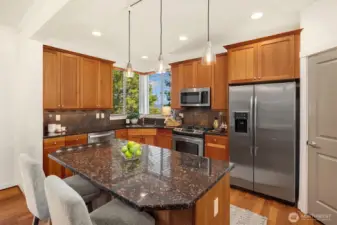 All appliances remain with the home for the new buyer, including the upper-level washer/dryer.