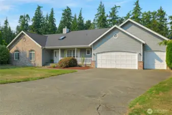 Spacious Rambler with 3 car garage and ample parking.