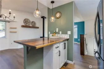 Rich wood countertop for this food prep/breakfast counter