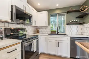 Crisp white cabinetry and classic subway tile backsplash