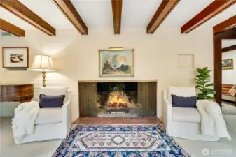 Grand fireplace in the living room with room for a grand piano to the left.