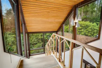 Look out to the incredible greenery that defines the home.