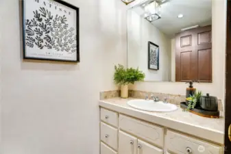 Main floor powder room off the entry.