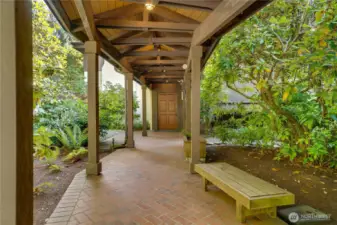 Stay dry with covered walkway from parking to main entry of home.