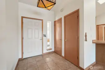 Extra closet space by front entry door