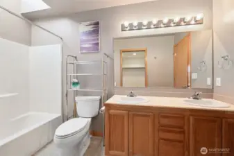 Master attached bathroom with dual sink vanity and ----