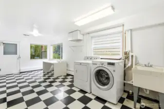 A large laundry room offers excellent functionality with ample space for storage and organization.