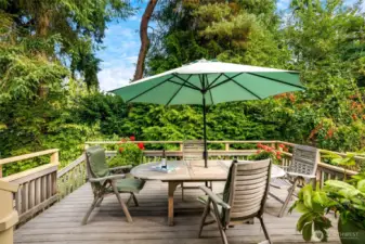 Step outside to a beautifully landscaped, mature yard offering privacy and a peaceful setting to relax, garden, or host summer barbecues.