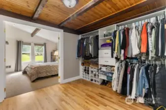 Walk in closet has extra space that could be used as an office or other flex space.
