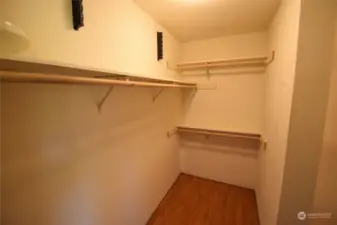 Primary bedroom walk-in closet