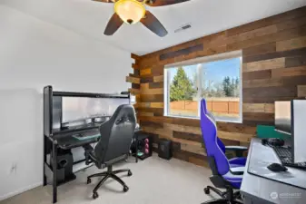 2nd bedroom, with wood planked wall.