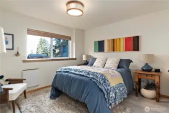 Second bedroom on lower level with window facing the water.