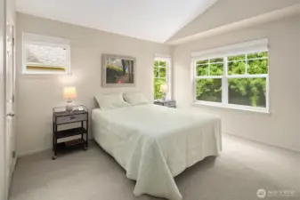 The primary suite has a large walk in closet.  Double vanity with spa tub and separate shower.  Soaring ceilings and overlooking the private back yard.