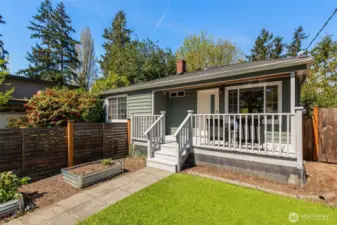 Stellar South-facing Home with Open Floor  Plan & Lower Level INCOME OPTIONS!  Serene setting on deadend strt in verdant  Victory Heights. Expansive main level: open  flow liv/din/kit for entertaining, big windows  on 3 sides light up your life, cozy 2-sided  frplc. Love this kitchen: counterspace for the  home chef to spread out & create, abundant  cabinetry, smart layout. Lower level options  galore: sep entrance = short-term rental  (rental history: 80%+ occupancy &  $105+/night), full ADU upside potential, or  retain as home theater +guest bed +home  office. AC, deluxe upstairs util room,  4-season covered front porch, fully-fenced  yard, 2 off-strt spots. Lightrail, Kraken facility,  revitaling Northgate, Maple Leaf shops, UW,  I-5 at your fingertips!