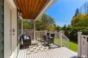 You will LOVE this covered, south-facing  porch! Ready for 4-season coffee sippin'!  Fully-fenced yard, veggie patch, low  maintence turf.