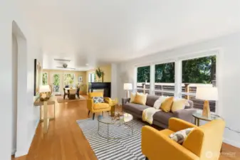 Expansive living room, dining room, and  kitchen with enchanting flow and natural  light from big windows on 3 sides! This will  be your daily hub.