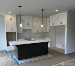 Home as of 06/25/25. Upgraded white cabinets to the ceiling in the kitchen, side by side fridge/freezer combo, and matte black hardware.