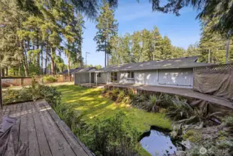 Wrap around deck from a former pool