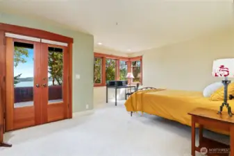Primary bedroom with private deck and views of Mt Ranier.