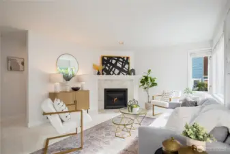 A bright and sunny living room makes a great first impression. New carpet and interior paint are inside.