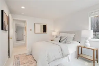 Right next door to the bathroom is the primary main floor bedroom.