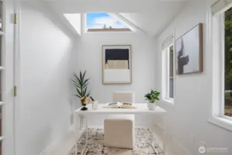 This wonderful connected space has walls of windows and an upper clerestory window for great light and style.