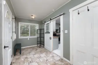 Sitting area/mudroom, backyard door.