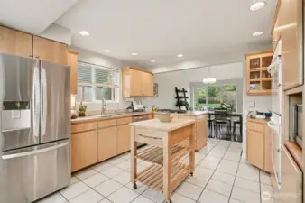 New gas cooktop, SS dishwasher, spacious sink & newer refrigerator.