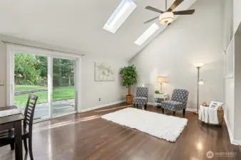 Bright and light featuring skylights, vaulted ceilings, LVP flooring throughout & a large fully-fenced yard.
